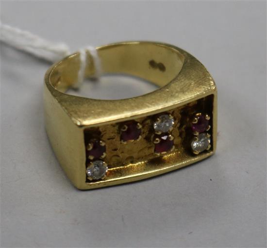 An early 1970s 18ct gold, ruby and diamond set ring, size K.